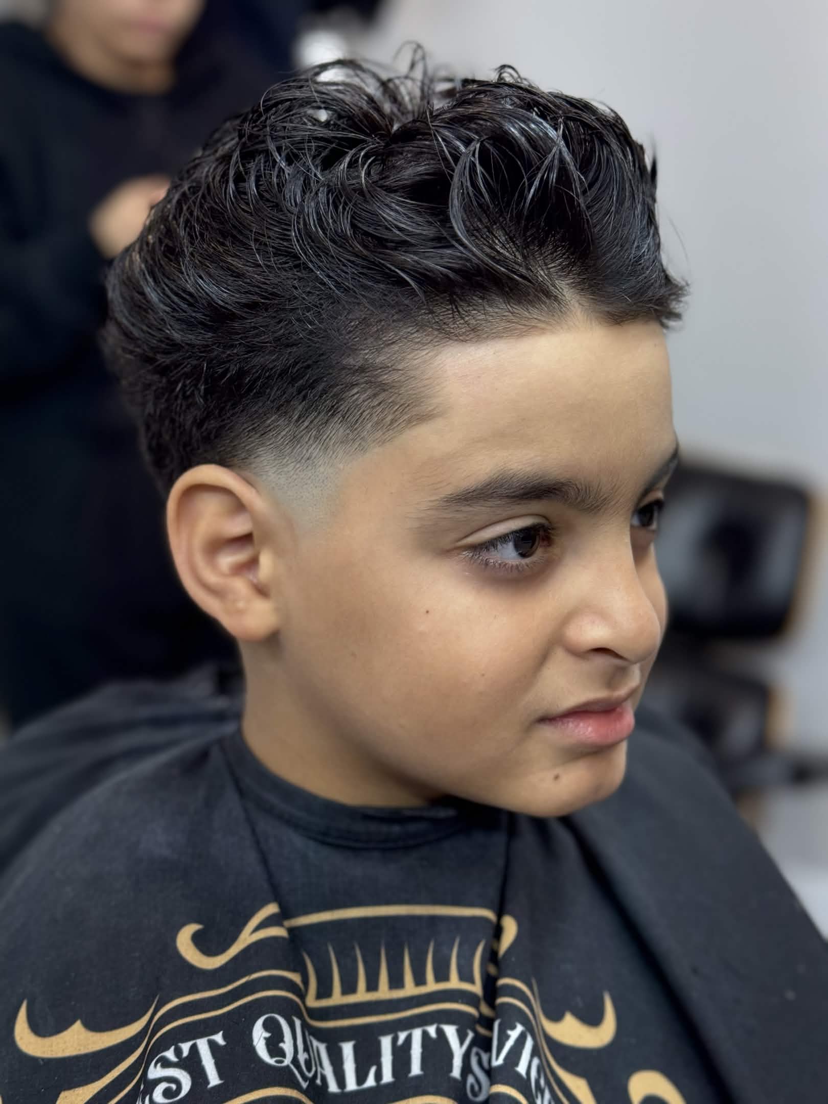 Kids taper fade with textured top by Kevin — Caveman's Den Astoria