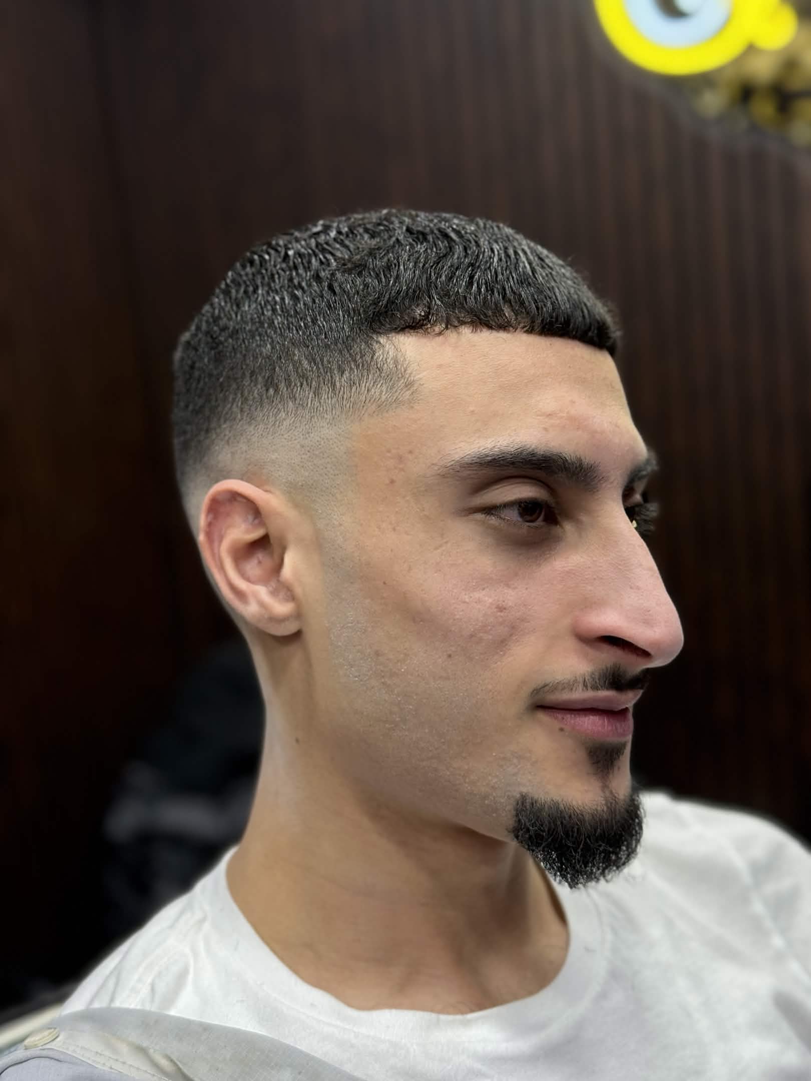 Textured crop fade with beard lineup by Kevin at Caveman's Den