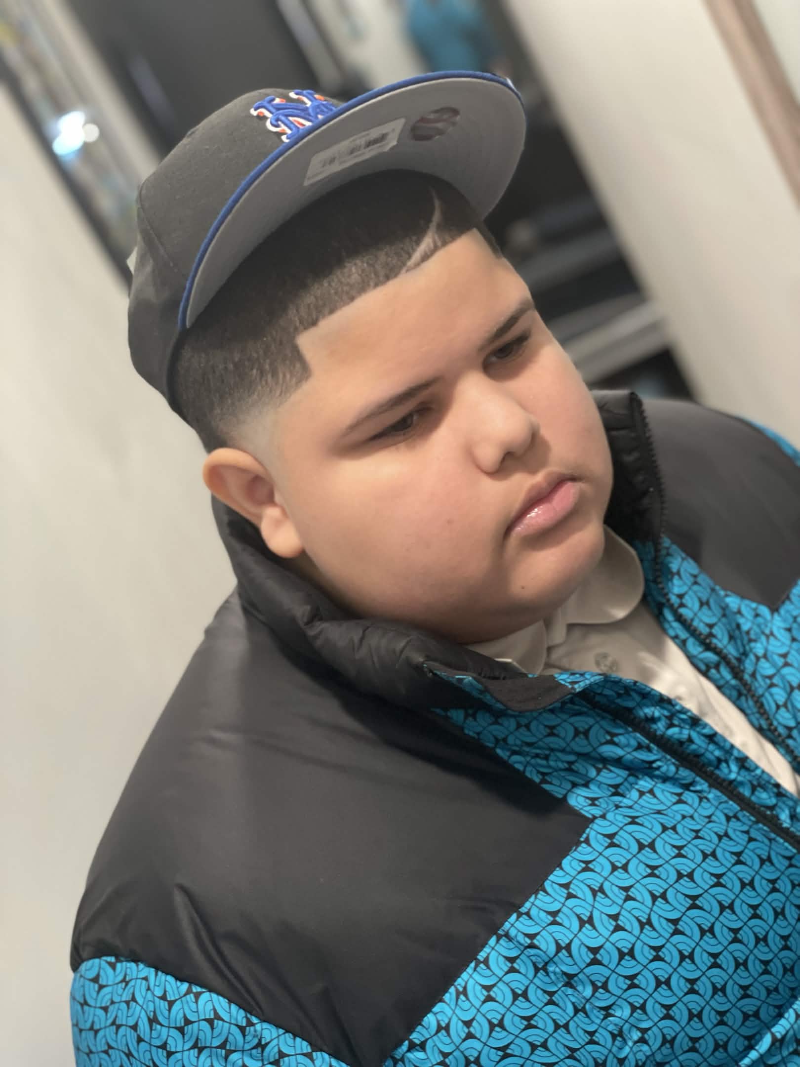 Kids fade with clean hairline — fresh cut at Caveman's Den Astoria
