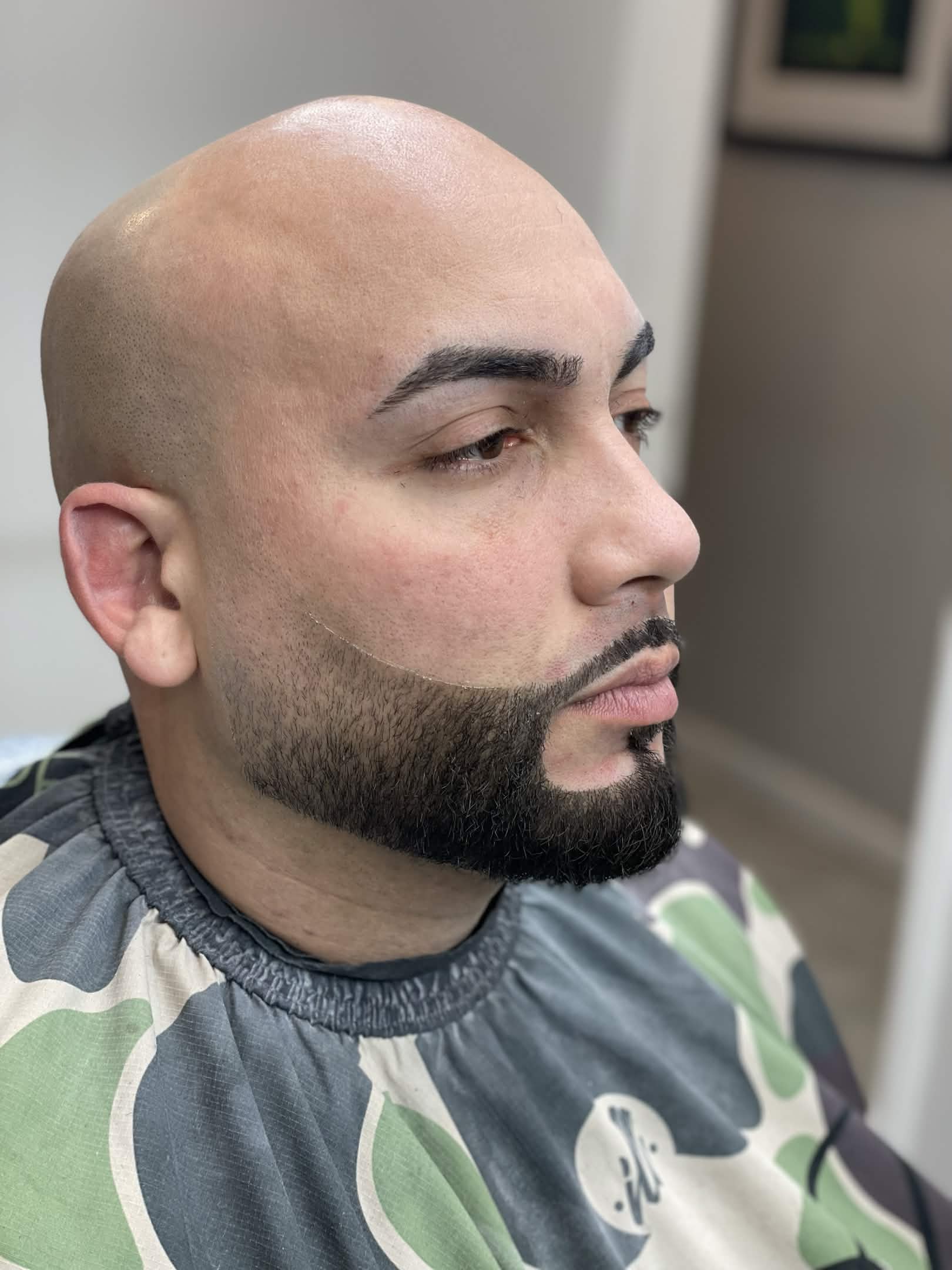 Bald head shave with beard shape and lineup at Caveman's Den